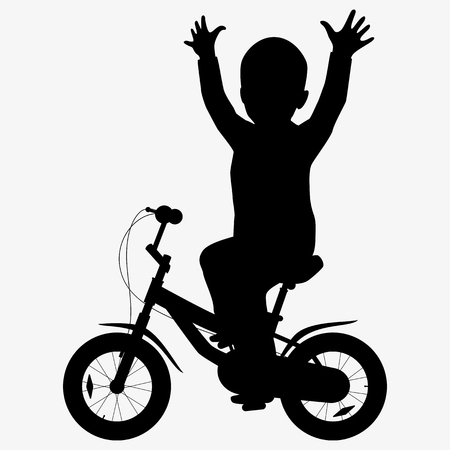 A boy rides a bicycle silhouetteの写真素材