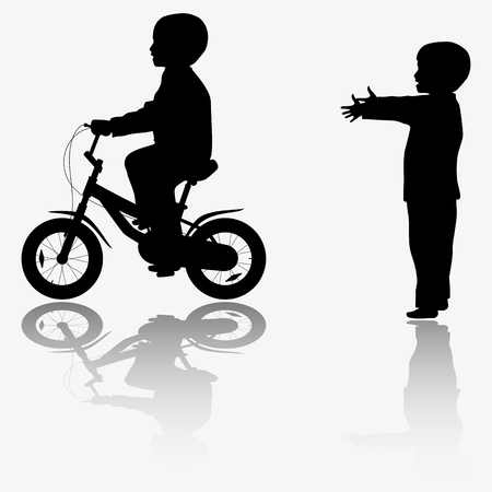 Kid and bicycle silhouetteの写真素材