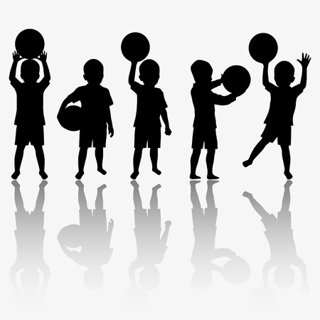 Children silhouettes playing with ballの写真素材