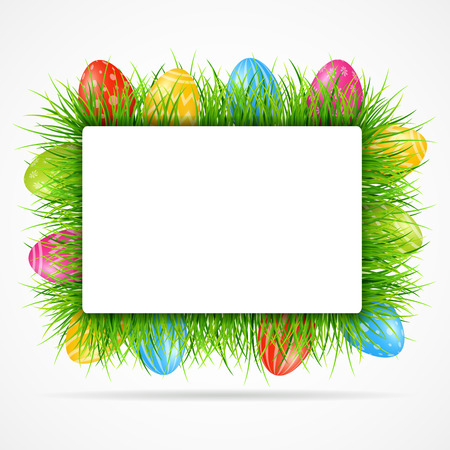 Easter eggs background with grass and blank signの写真素材