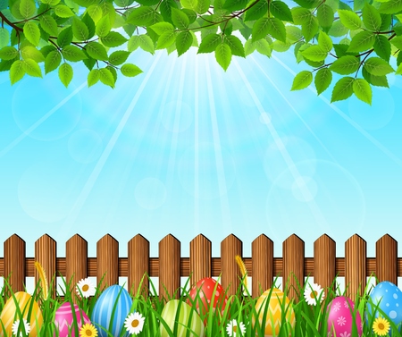 Easter background with colorful eggs in the grassの写真素材