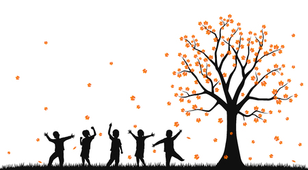 Happy children in the autumn parkの写真素材