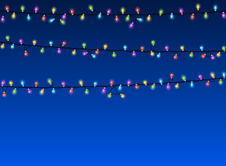 Christmas lights on blue backgroundの写真素材