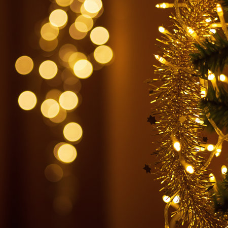Christmas background with christmas tree and bokeh lights. Copy space.の素材