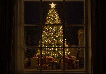 Christmas tree with presents in front of the window at night, Christmas backgroundの素材