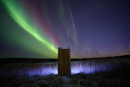 Aurora borealis or northern lights over a door in Icelandの素材
