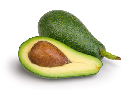Half and whole fresh green avocados isolated on white background. Studio shotの写真素材