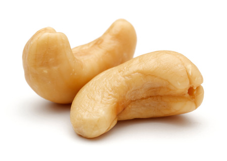 Roasted cashew nuts isolated on white background. Macro, studio shotの写真素材