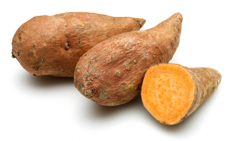 Sweet potato with slices isolated on white backgroundの写真素材