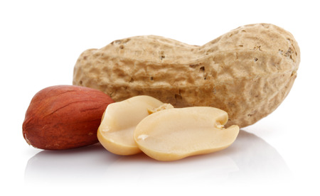 Peanuts isolated on white background, macro shotの写真素材