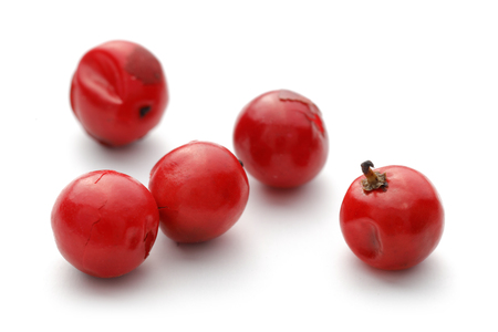 Red Peppercorn isolated on white backgroundの写真素材