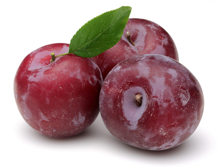 Red plums with leaf isolated on white backgroundの写真素材