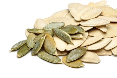Pumpkin seeds isolated on white backgroundの写真素材