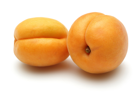 Fresh apricot fruits isolated on white backgroundの写真素材