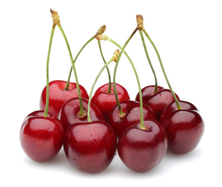 Ripe red cherries isolated on white background