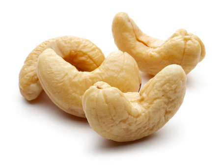 Raw cashew nuts isolated on white backgroundの写真素材