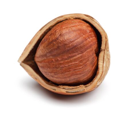 Broken hazelnut isolated on white background