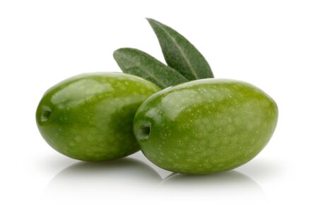 Green olives with leaves isolated on white backgroundの写真素材