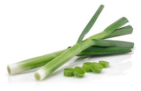 Fresh green garlic with slices isolated on white backgroundの写真素材