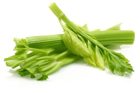 Fresh celery stalks and leaves isolated on white backgroundの写真素材