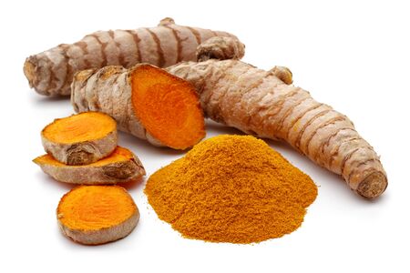 Fresh turmeric with slices and curcuma powder isolated on white backgroundの写真素材