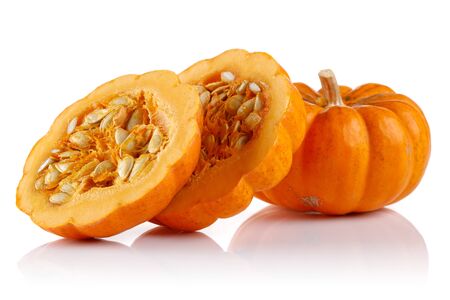 Whole mini pumpkin with slices isolated on white backgroundの写真素材