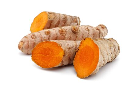 Fresh turmeric with slices isolated on white backgroundの写真素材