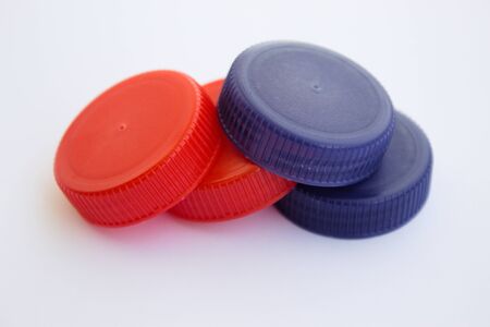 Isolated on white background bunch of plastic bottle caps
