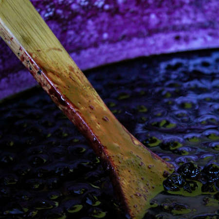 A wooden spoon in a pot of chokeberry jam. Aronia jam in a pot. Zavidovici, Bosnia and Herzegovina.の写真素材