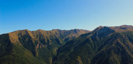 Above the old Bosnian village of Lukomir are beautiful mountains with no vegetation mountain peaks....