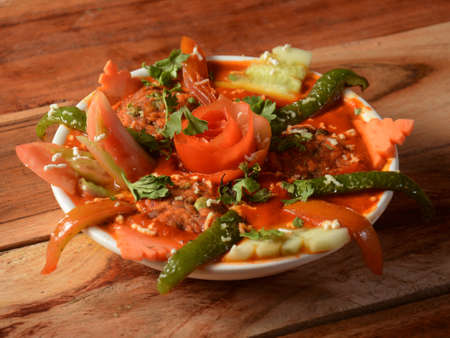 Paneer maharaja, is a famous indian dish, served over a rustic wooden background, selective focusの写真素材