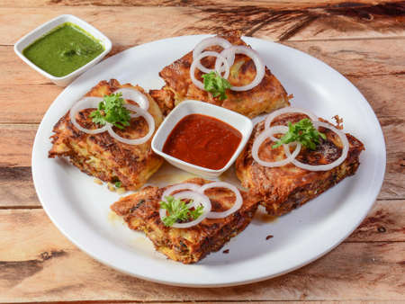 chicken baida roti, isolated over a rustic wooden background, selective focusの写真素材