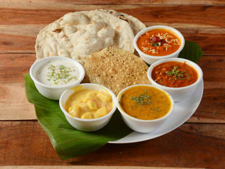 Maharaja Veg Thali from an indian cuisine, food platter consists variety of veggies,paneer dish,...
