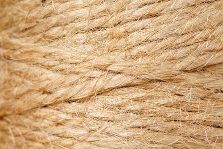 Background from a spool of jute twine. Macro shot, shallow depth of field