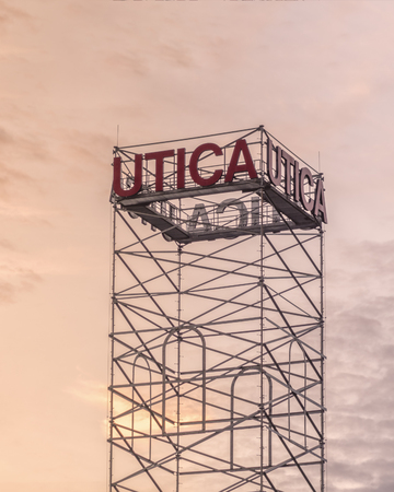 UTICA, NEW YORK - OCT 05, 2018: Utica City Tower Picture with Utica Sign in Red.