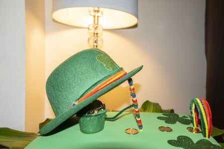 Happy St Patricks Day green leprechaun hat with gold covered chocolate coinsの写真素材