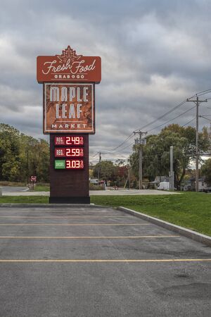 VERONA BEACH, NEW YORK - Oct 19, 2019: - Evening View of Maple Leaf Market Fuel Sign Prices, Maple Leaf is a Convenience Store Chain and Gas Station with All Day Food Serving Grab & Go.のeditorial素材