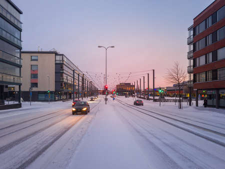 Turku, Finland - December 24, 2021: Horizontal Closeup Snowy View of Raisiontie Street in Turku, Finland.のeditorial素材