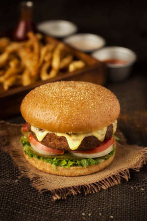 There is nothing sweeter than melted cheese on top of a piece of meatの写真素材