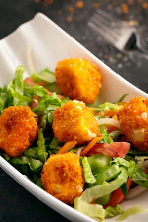 Crispy Greek Caesar salad with delicious chicken piecesの写真素材