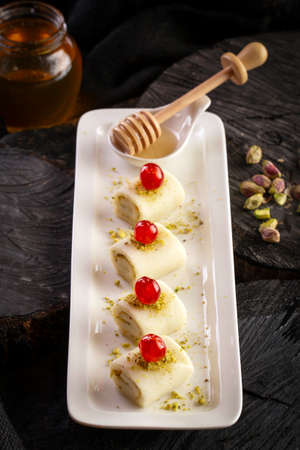 Sweets with white cheese and pistachioの写真素材