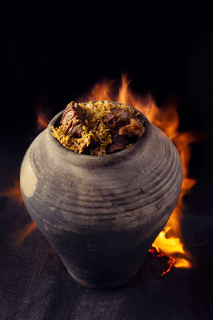 Moroccan-style pottery tagine with chicken and vegetablesの写真素材