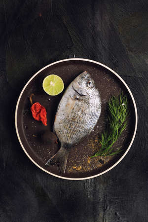 Medium sized fish with a little lemonの写真素材