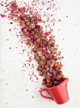 A cup of beautiful red Muhammadi rosesの写真素材