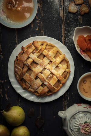 Apple pie served on a beautiful antique floorの写真素材