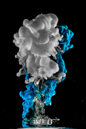 ink dropped in water , shot with nikond d5100 and a 35 mm lens - 3 light sourcesの写真素材