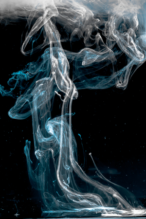 ink dropped in water , shot with nikond d5100 and a 35 mm lens - 3 light sourcesの写真素材