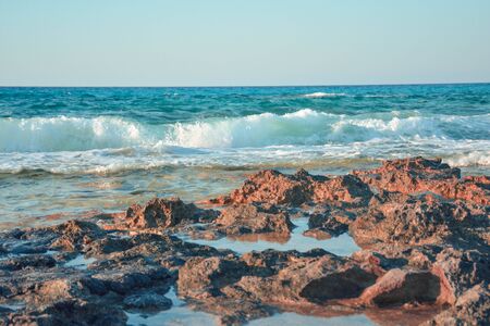 rocks , clear sky and wavy seaのeditorial素材