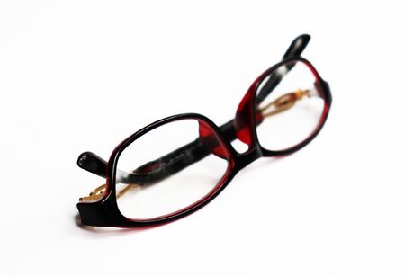 Red frame glasses isolated on white backgroundの写真素材