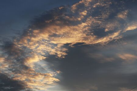 Cloudy sky. Blue sky with black and red clouds